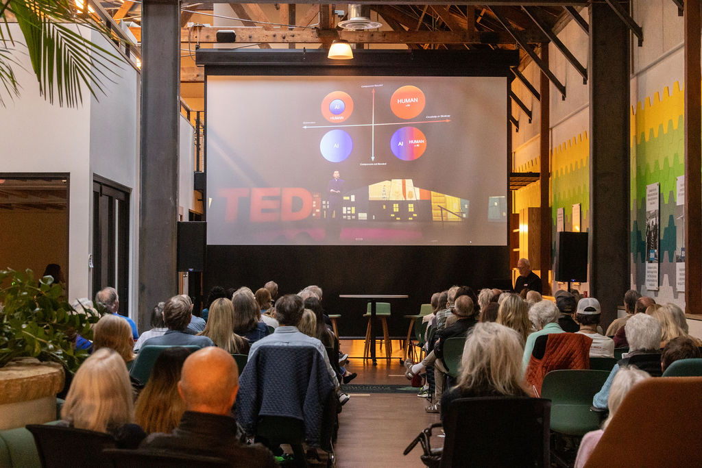 The audience watching a TED talk on the big screen at CEC's Environmental Hub.